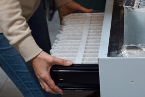 man performing air filter replacement